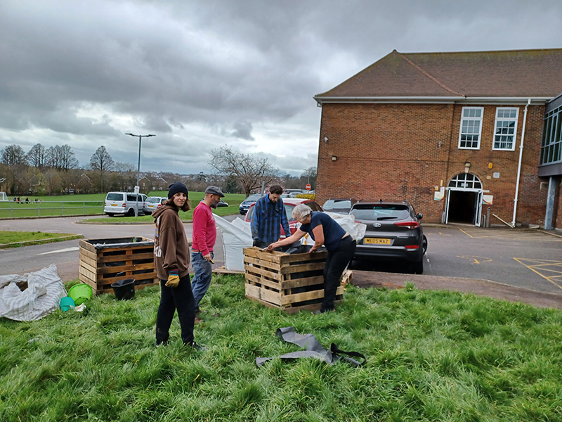 Volunteers making planters at Downs View Link College Volunteers making planters at Downs View Link College