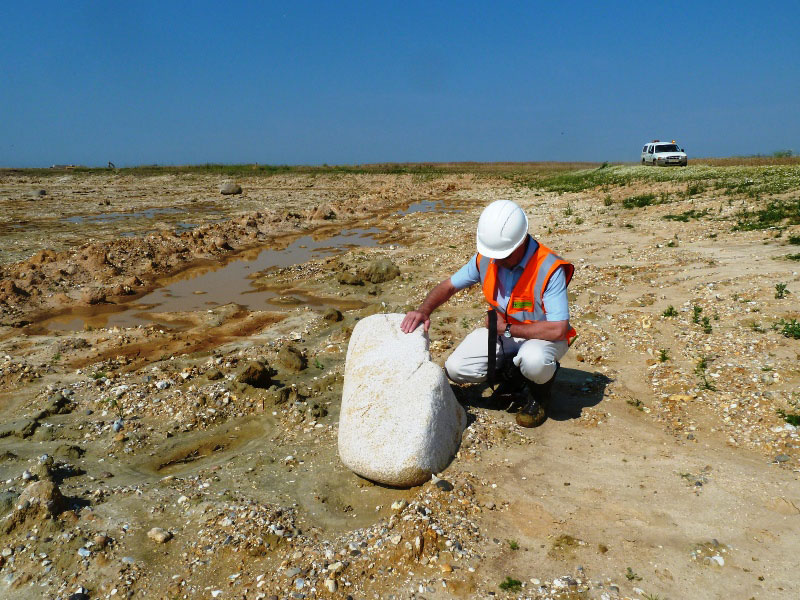 Iceberg-transported granite boulder in excavation at Medmerry