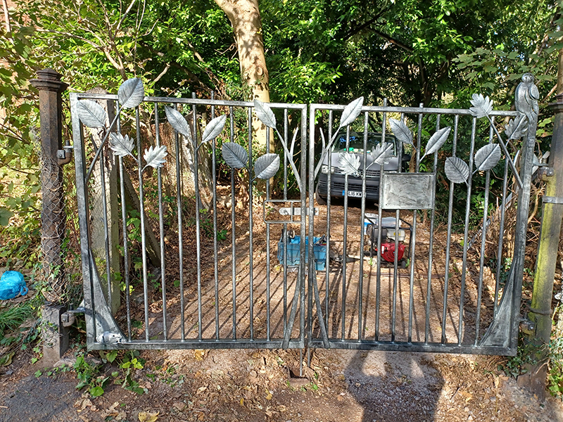 Leaf-decorated wrought iron gate created by blacksmith James Price