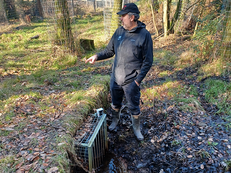 Dave Elliott showing the water's exit point from the enclosure Dave Elliott showing the water's exit point from the enclosure