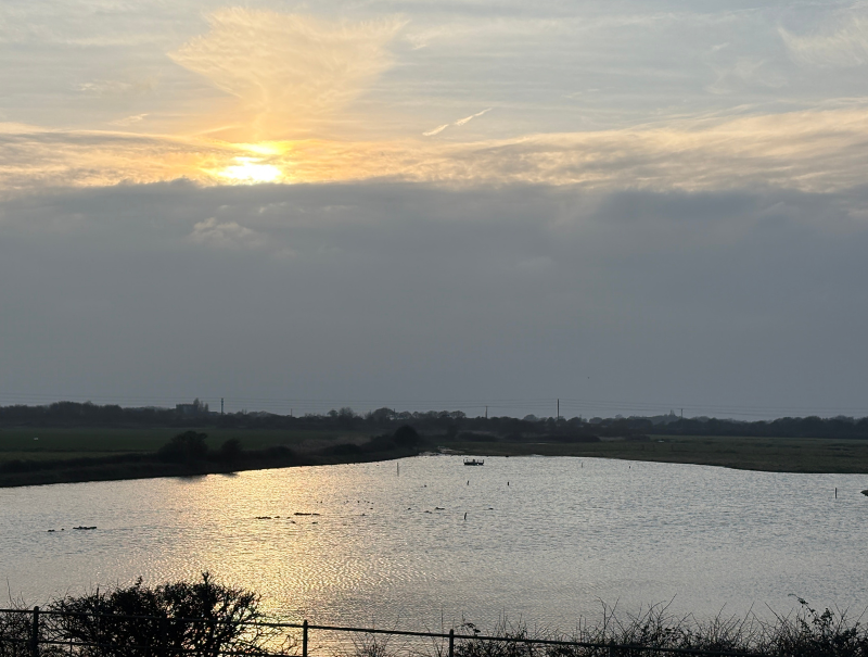 Sunset over Ferry Pool, as viewed from the hide © RSPB