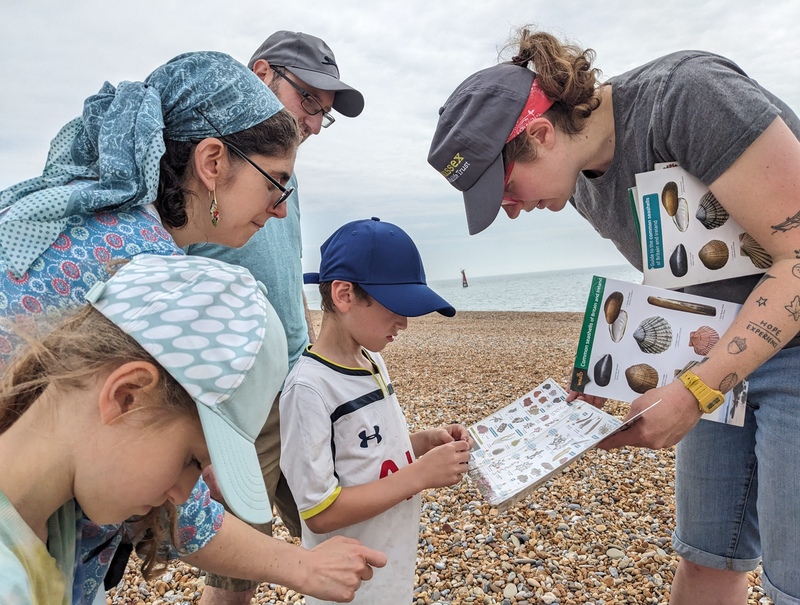Alice and a family taking part in a scavenger hunt